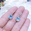 4.01CT Blue Topaz and Diamond Halo Dangling Earrings in 14K White Gold (etsy image id: 3135237812)