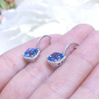 4.01CT Blue Topaz and Diamond Halo Dangling Earrings in 14K White Gold (etsy image id: 3135237886)