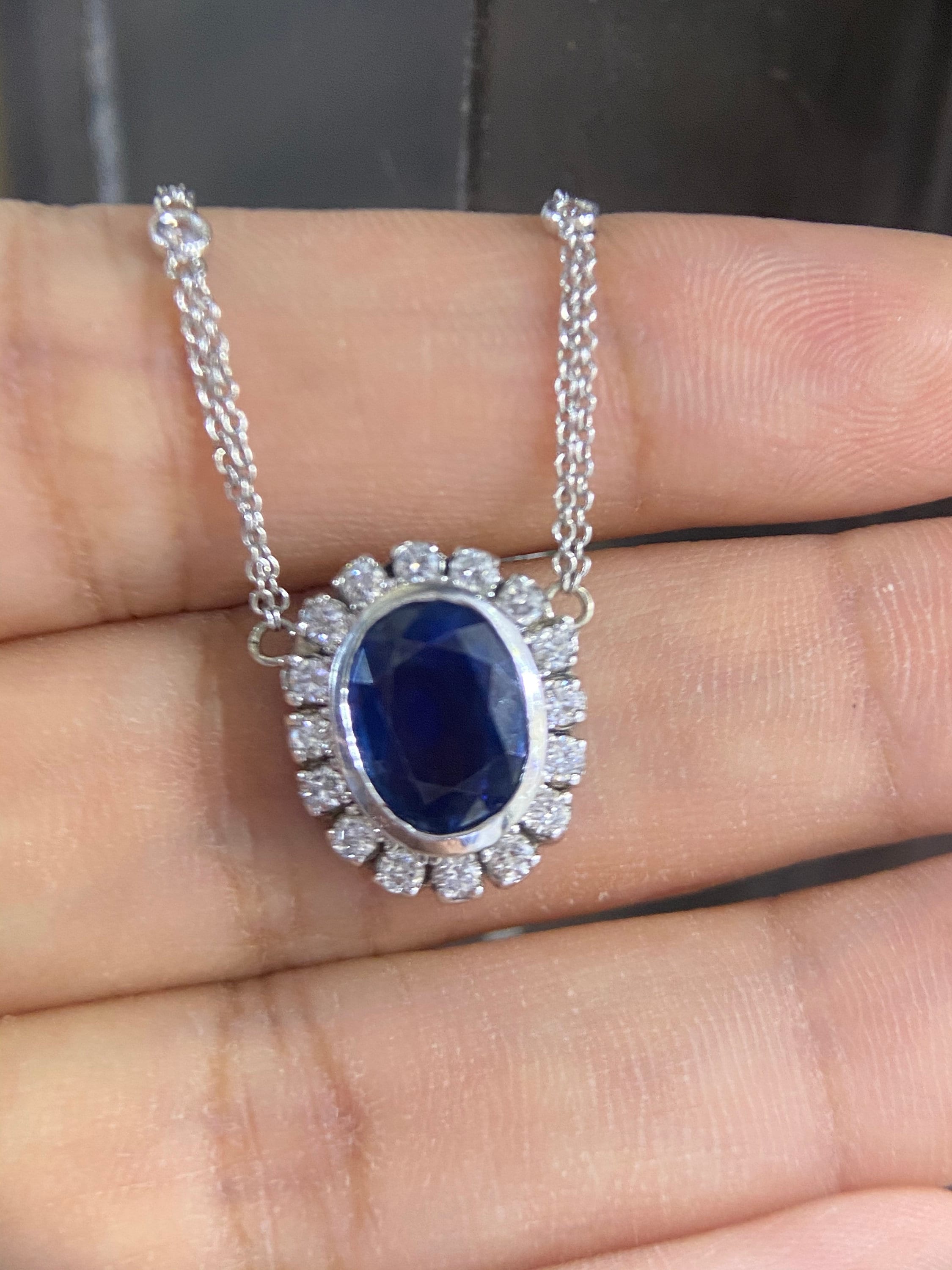 Oval blue sapphire with diamond pendant. (etsy image id: 4094100768)