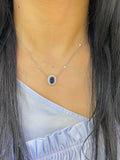 Oval blue sapphire with diamond pendant. (etsy image id: 4141751579)