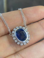 Oval blue sapphire with diamond pendant. (etsy image id: 4141755587)