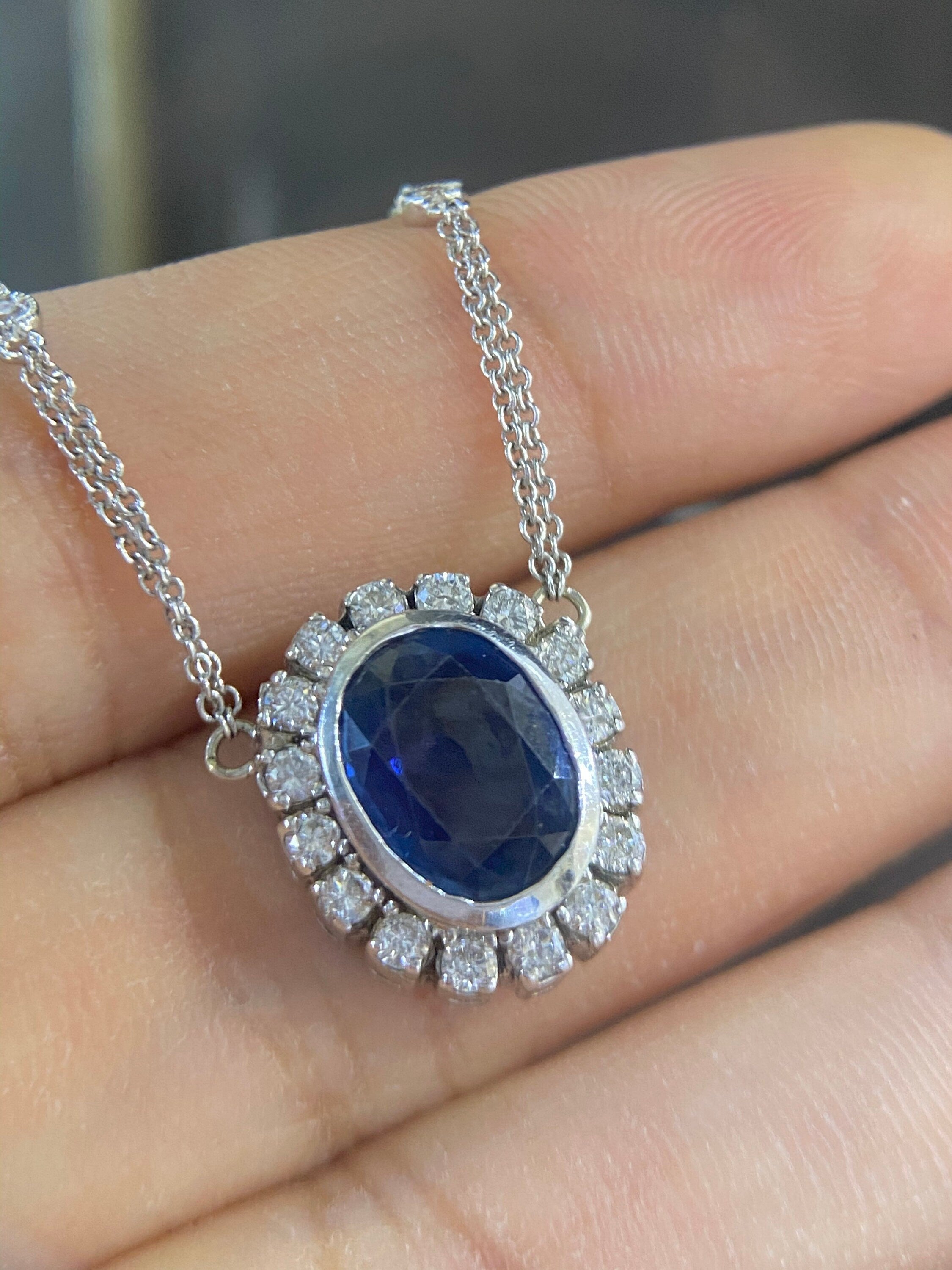 Oval blue sapphire with diamond pendant. (etsy image id: 4141755587)