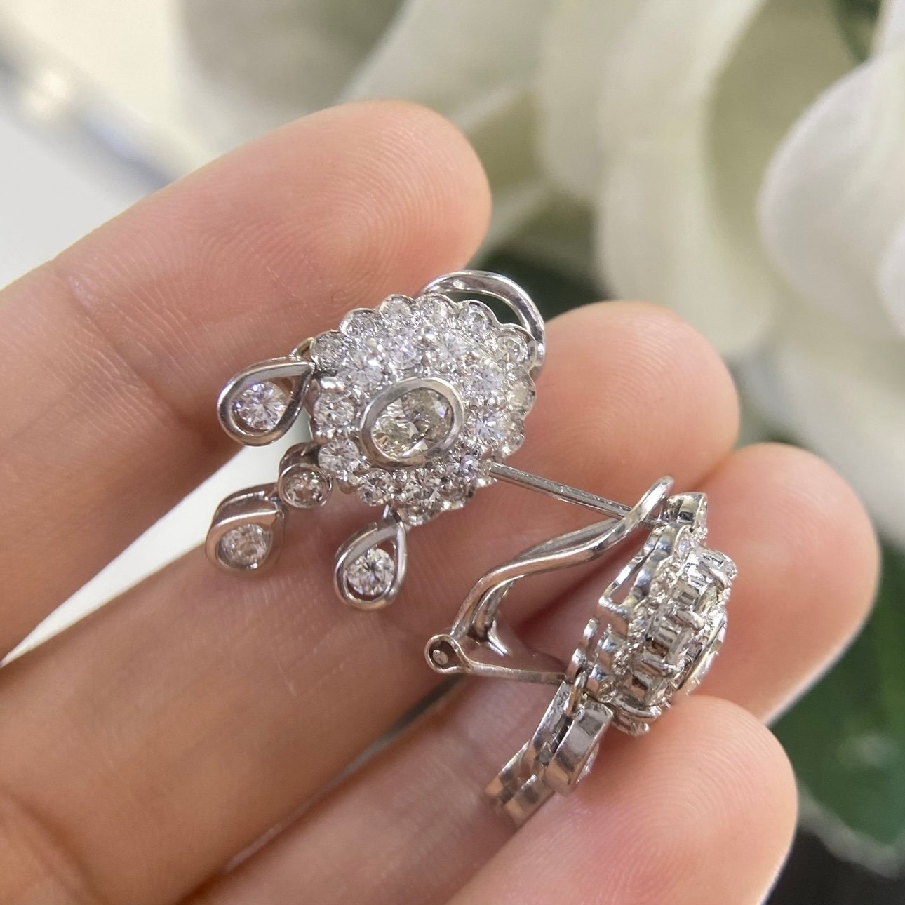 White Gold Hanging Earrings with a Oval Cut Center Stone Diamond and Surrounding Round Cut Diamonds (etsy image id: 4776913154)