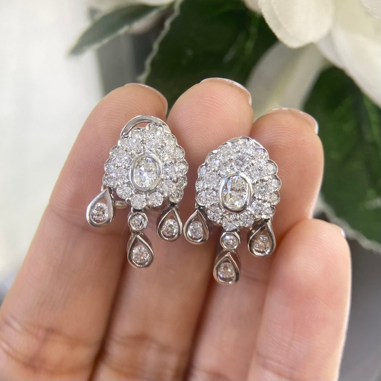 White Gold Hanging Earrings with a Oval Cut Center Stone Diamond and Surrounding Round Cut Diamonds (etsy image id: 4825180207)
