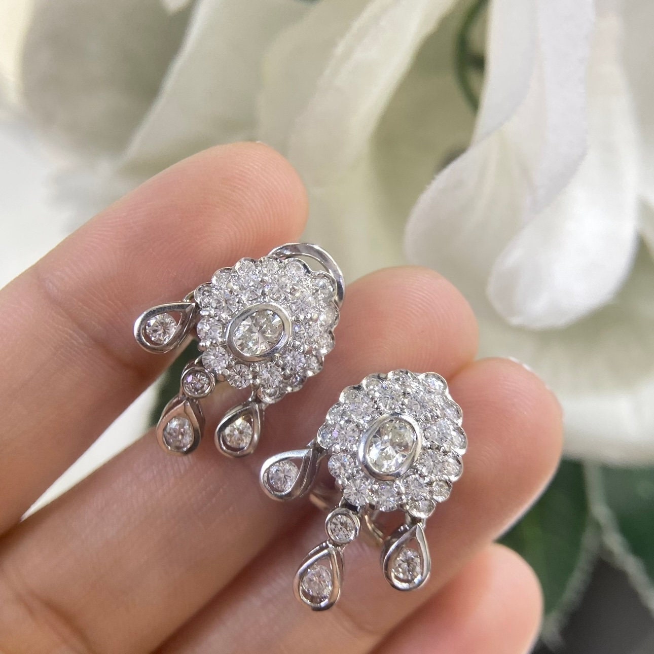 White Gold Hanging Earrings with a Oval Cut Center Stone Diamond and Surrounding Round Cut Diamonds (etsy image id: 4825180211)