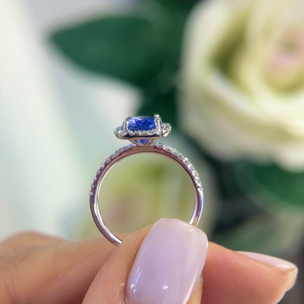 White Gold Diamond Tanzanite Ring in Halo Setting with Half Circle Diamonds of The Band (etsy image id: 5888366755)