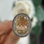 14Kt Yellow Gold Ring with an oval cut 19.32ct smoky topaz  0.31ct total in round cut white diamonds ,and 1.22ct total in champagne diamonds (etsy image id: 5916581964)