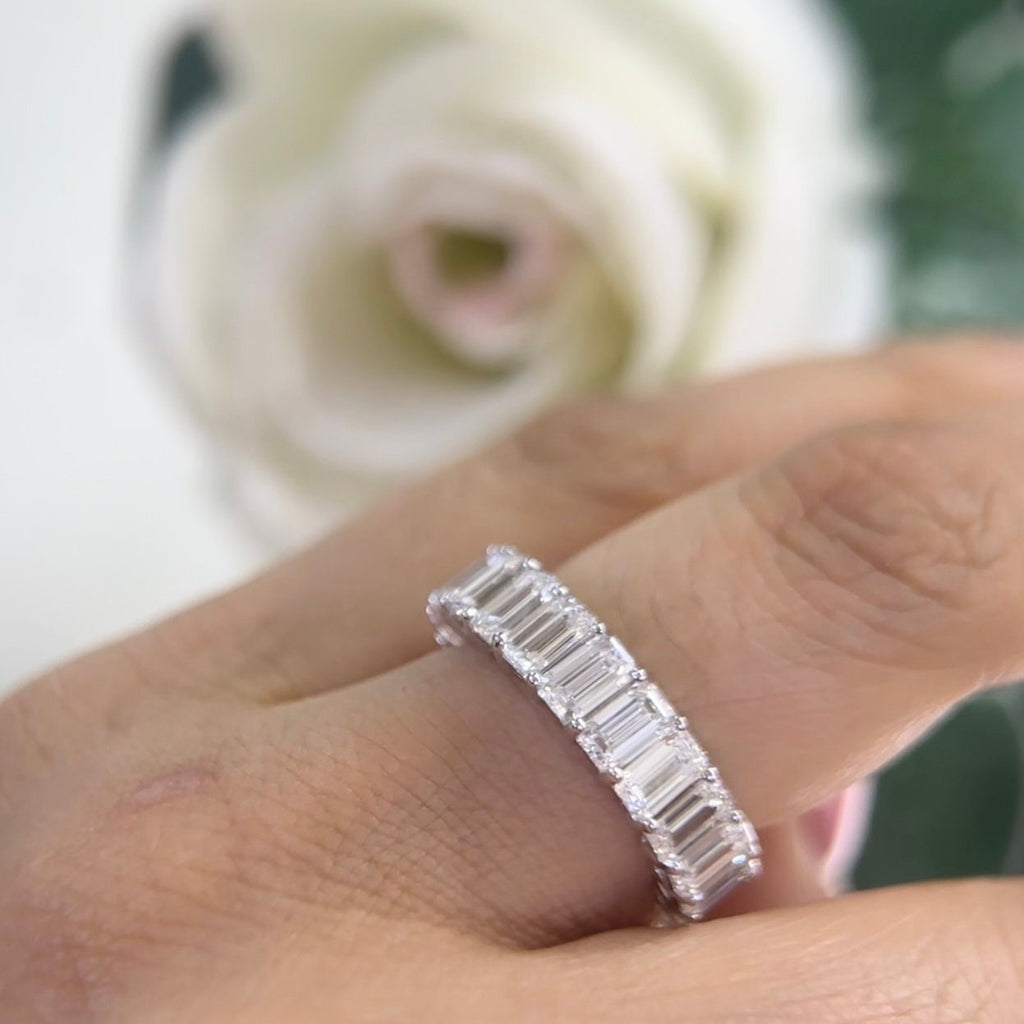 14Kt White Gold eternity band with 6.65ct total in Emerald cut Lab Grown Diamonds. WB588 ISJJ (etsy image id: 5964640109)