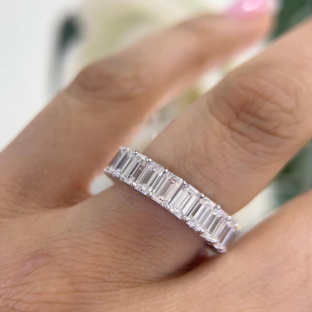 14Kt White Gold eternity band with 6.65ct total in Emerald cut Lab Grown Diamonds. WB588 ISJJ (etsy image id: 5964640115)