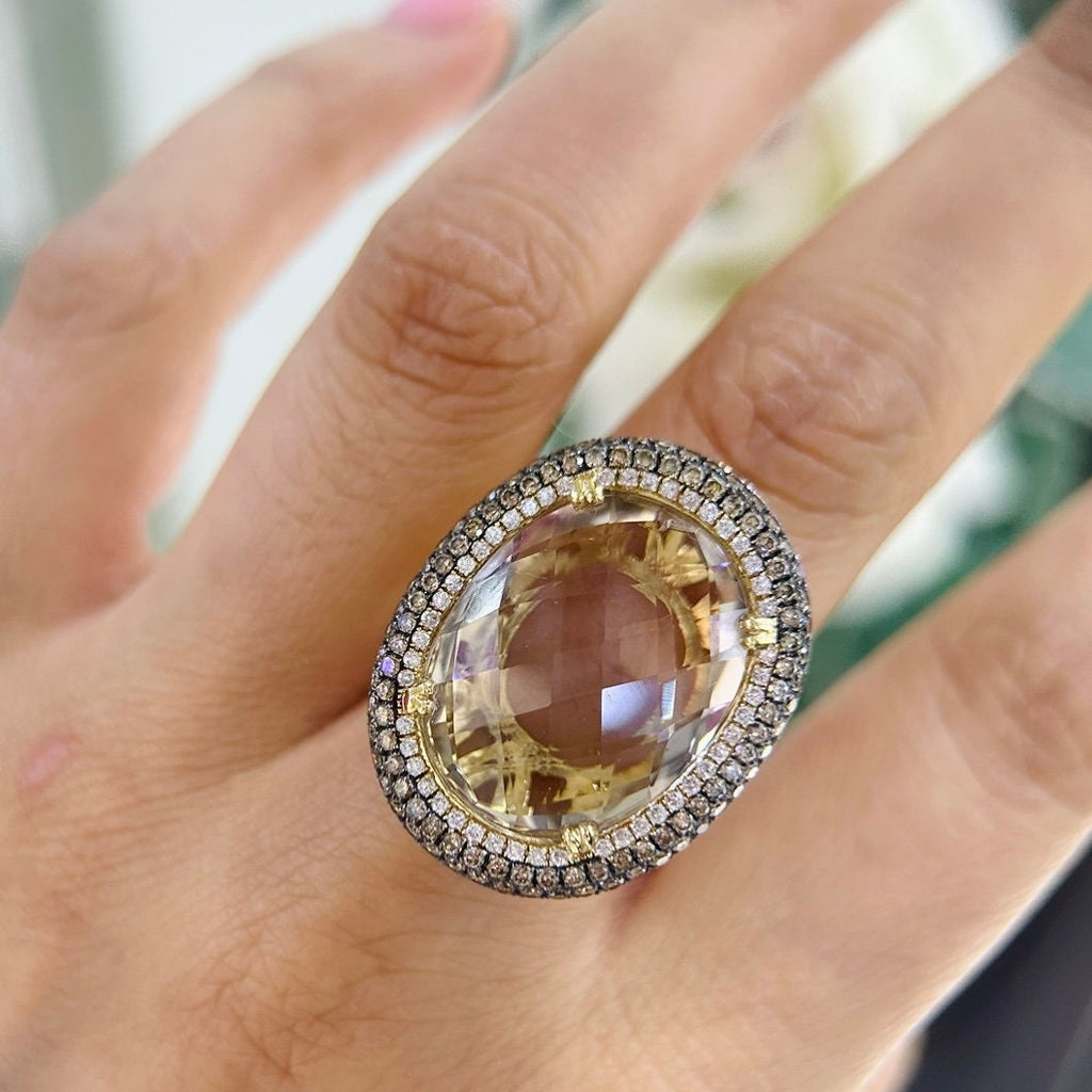 14Kt Yellow Gold Ring with an oval cut 19.32ct smoky topaz  0.31ct total in round cut white diamonds ,and 1.22ct total in champagne diamonds (etsy image id: 5964667673)