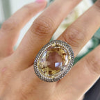 14Kt Yellow Gold Ring with an oval cut 19.32ct smoky topaz  0.31ct total in round cut white diamonds ,and 1.22ct total in champagne diamonds (etsy image id: 5964667673)