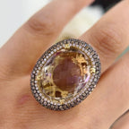 14Kt Yellow Gold Ring with an oval cut 19.32ct smoky topaz  0.31ct total in round cut white diamonds ,and 1.22ct total in champagne diamonds (etsy image id: 5964667689)