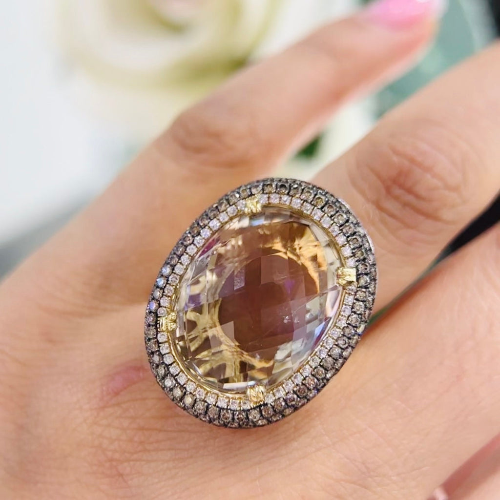 14Kt Yellow Gold Ring with an oval cut 19.32ct smoky topaz  0.31ct total in round cut white diamonds ,and 1.22ct total in champagne diamonds (etsy image id: 5964667697)