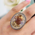 14Kt Yellow Gold Ring with an oval cut 19.32ct smoky topaz  0.31ct total in round cut white diamonds ,and 1.22ct total in champagne diamonds (etsy image id: 5964667697)