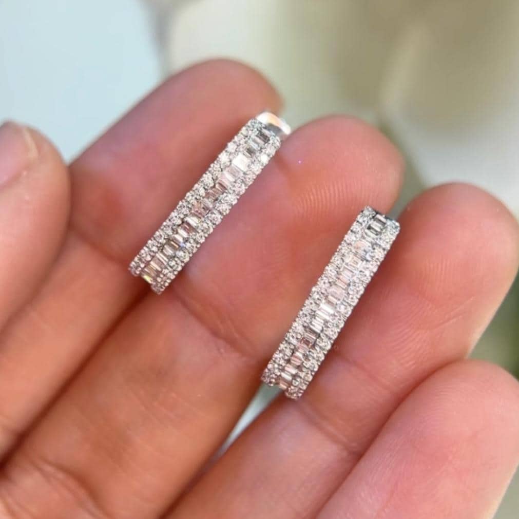 Woman holding Diamond White Gold Huggie Diamond Earrings (etsy image id: 6686709234)