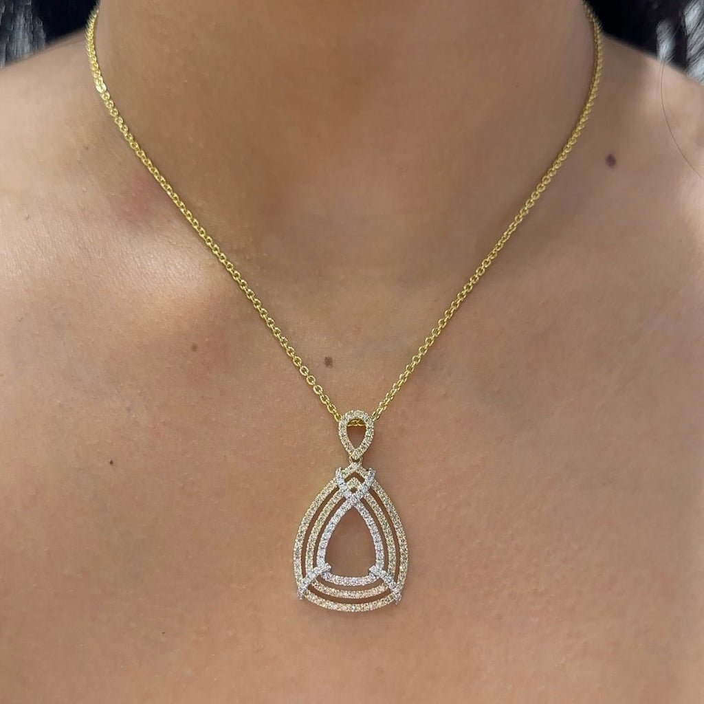 Woman wearing yellow gold necklace with pear shape three row pave diamonds pendant (etsy image id: 6707499234)