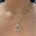 Woman wearing yellow gold necklace with pear shape three row pave diamonds pendant (etsy image id: 6707499234)