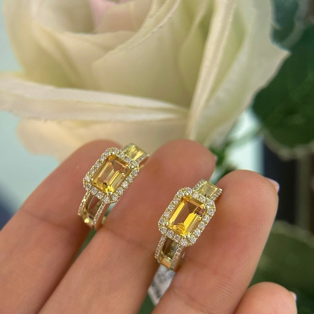 Woman holding yellow gold citrine and diamond huggie earrings (etsy image id: 6710327548)