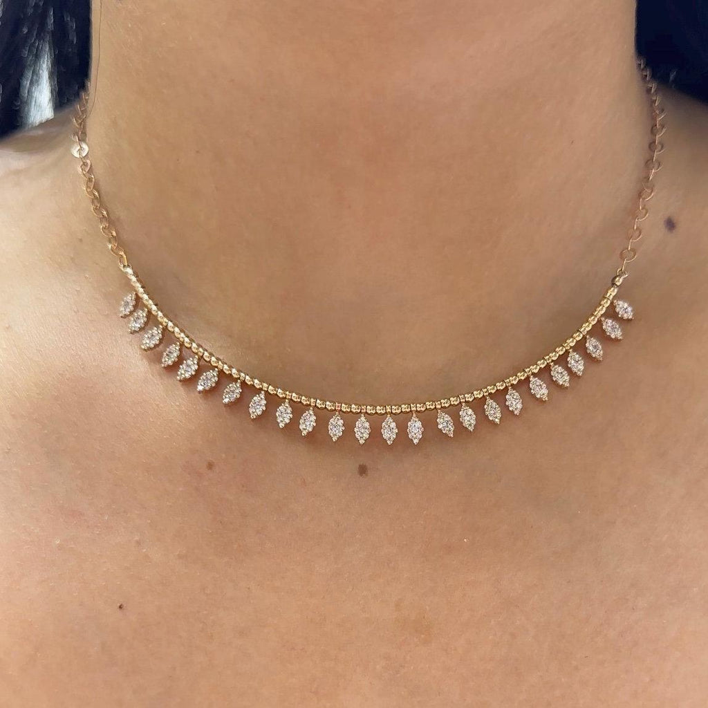 Woman wearing rose gold smile necklace with marquise shape prong setting with round cut diamonds  suspended of the smile pendant. (etsy image id: 6712734954)