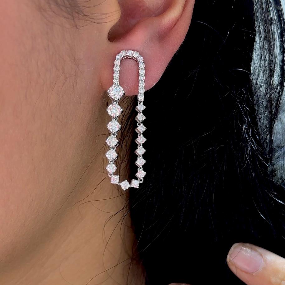 White Gold Dangling Drop Diamond Earrings Featuring Round Cut Diamonds (etsy image id: 6734740567)