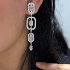 Woman wearing elongated dangling Art Deco style earrings  featuring lab diamonds (etsy image id: 6746101969)