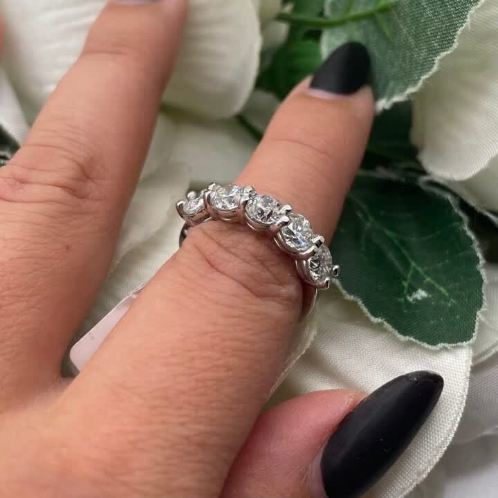 Woman wearing white gold five stone diamond band (etsy image id: 6765208776)