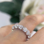 Woman wearing full circle eternity band ring in white gold (etsy image id: 6776489407)