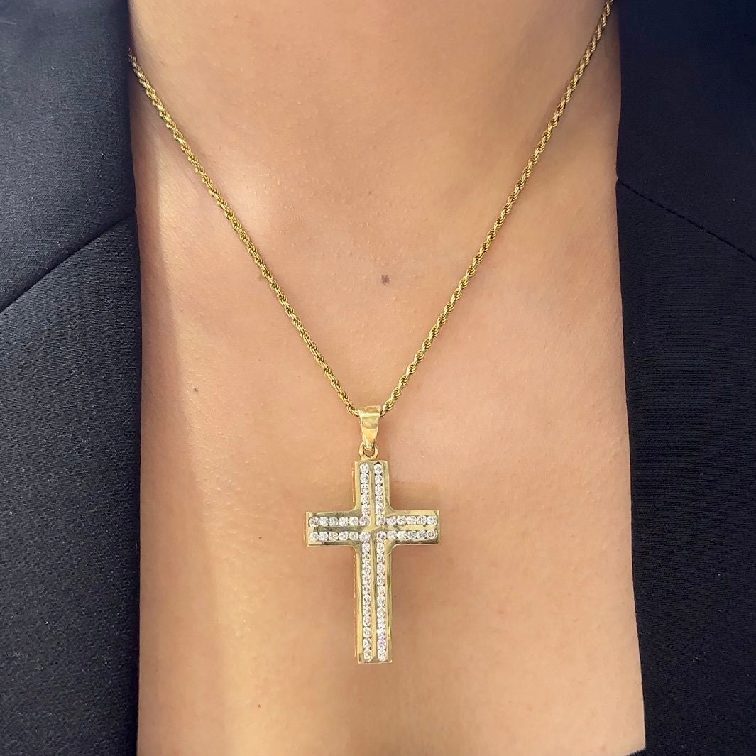 Woman wearing yellow gold chain with a yellow gold diamond cross (etsy image id: 6776598345)