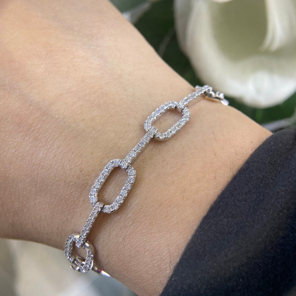 Woman wearing white gold small paperclip link diamond bracelet (etsy image id: 6781865951)