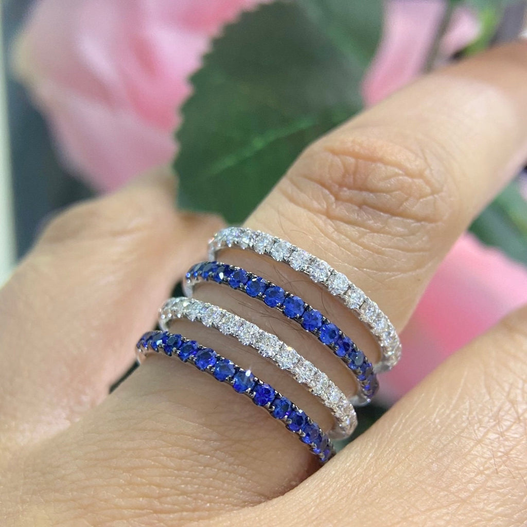 May include: Four eternity bands with a row of blue sapphires and a row of white diamonds. The bands are stacked on top of each other. (etsy image id: 6876965795)