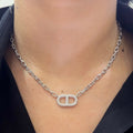 May include: A silver chain necklace with a diamond encrusted pendant in the shape of a double 'C' (etsy image id: 6888287949)