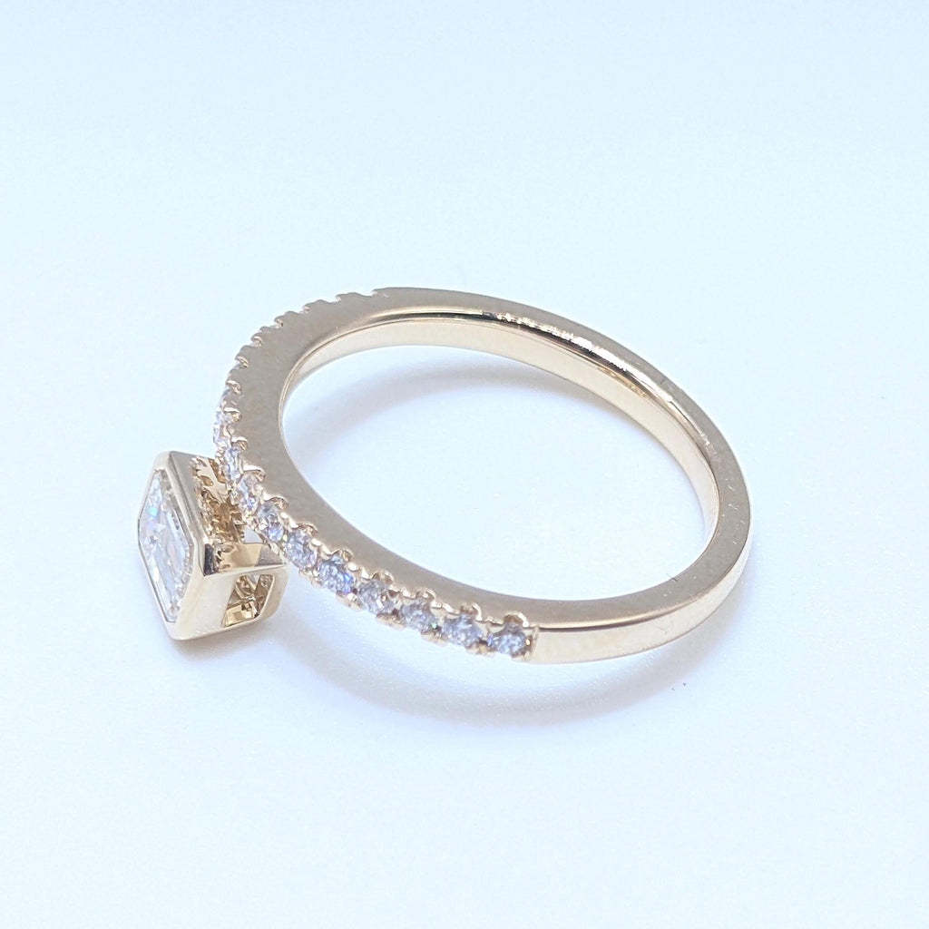 Yellow Gold Band Ring with Half Way Set Round Diamonds and One Emerald Cut Diamond (etsy image id: 6929529726)