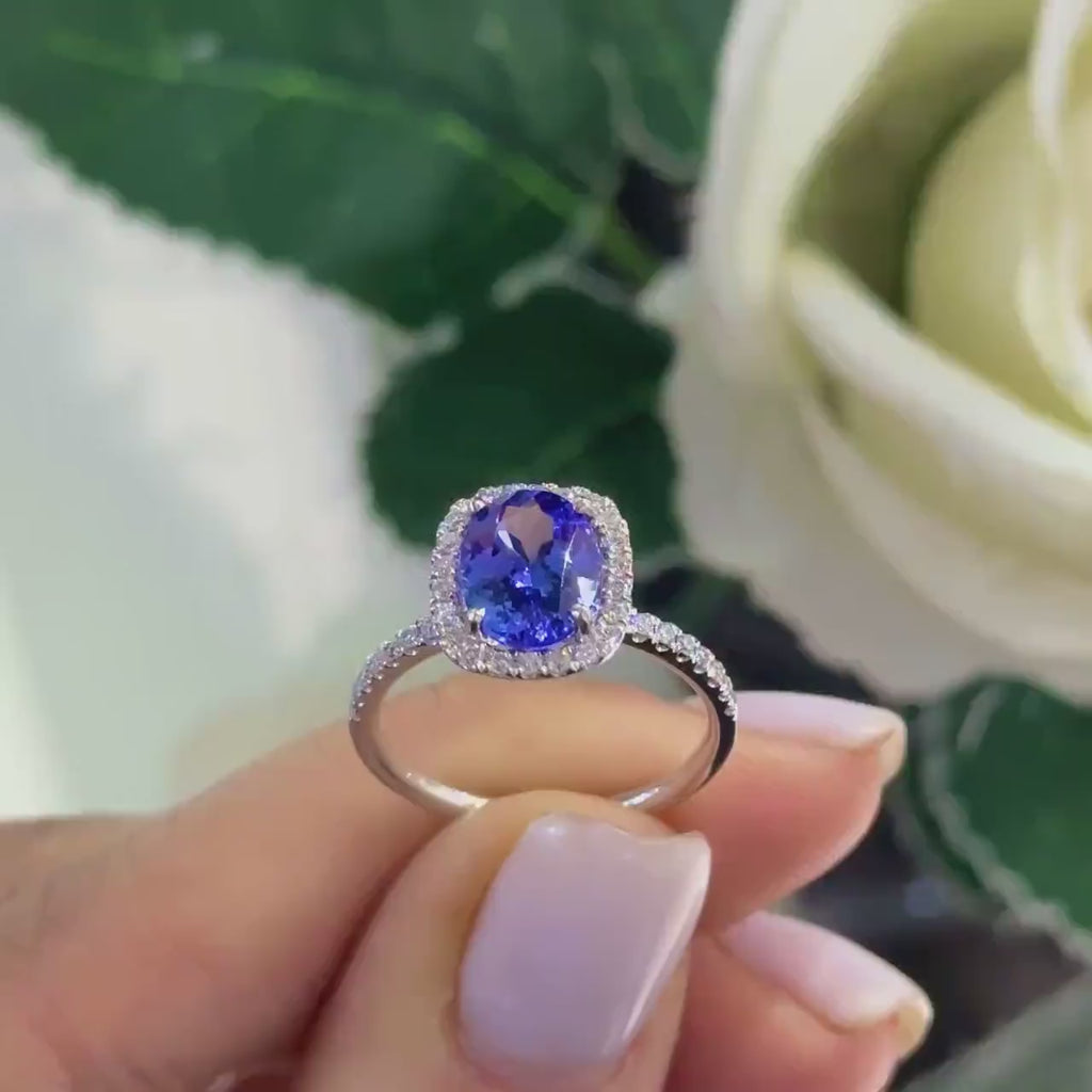 White Gold Diamond Tanzanite Ring in Halo Setting with Half Circle Diamonds of The Band
